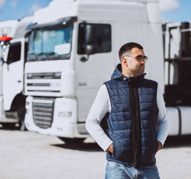 Man driver of the lorry in a logistic company